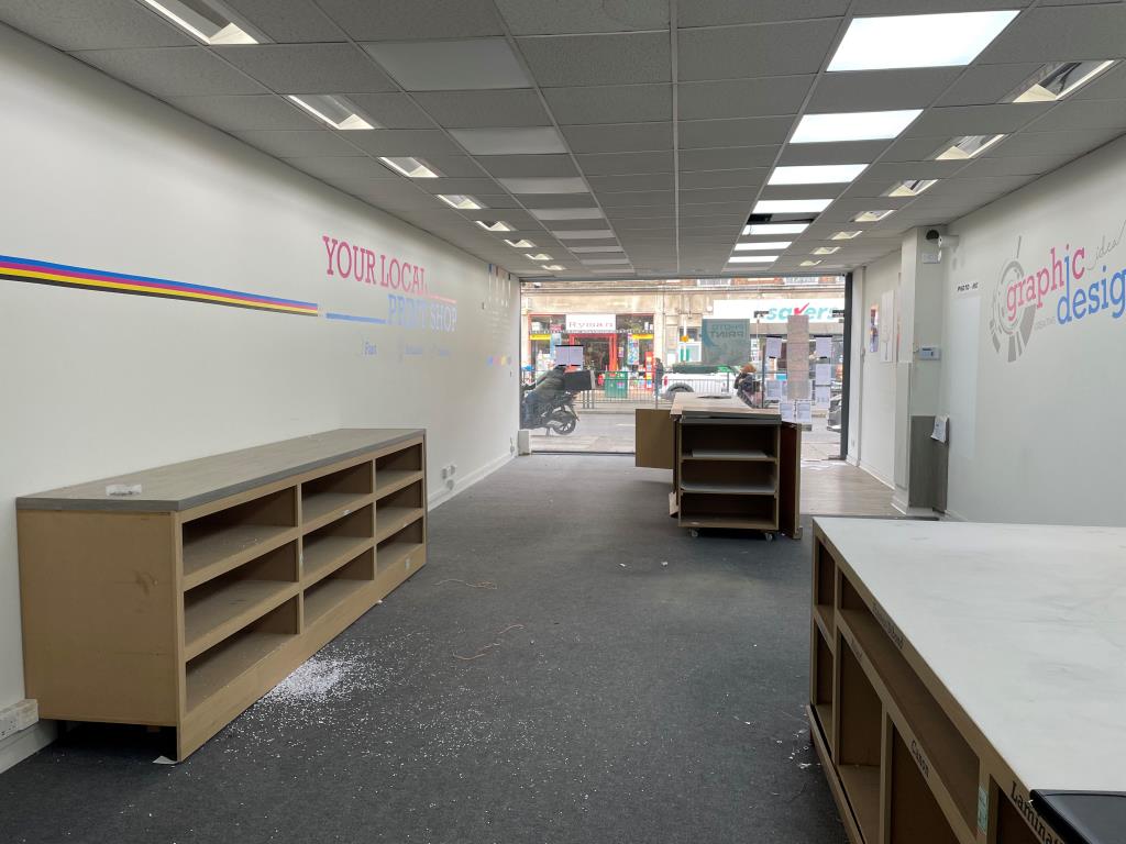 Lot: 105 - MIXED-USE PART POSSESSION PROPERTY IN BUSY THOROUGHFARE - Internal view of retail unit from rear